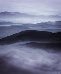 aerial view of fog covering hills, dark fantasy landscape