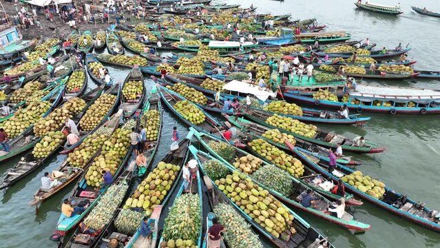Aerial view of floating market of seasonal fruits on the boats in Kaptai Lake, Rangamati, Bangladesh.