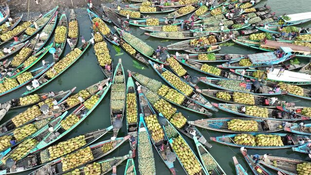 Aerial view of floating market of seasonal fruits on the boats in Kaptai Lake, Rangamati, Bangladesh.