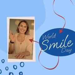 Composite of world smile day and caucasian woman smiling over arrow pattern on blue background