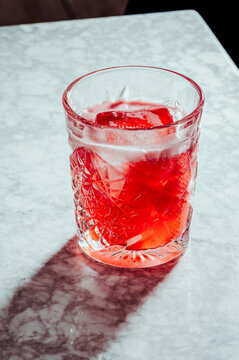 Glass of cold red alcohol drink