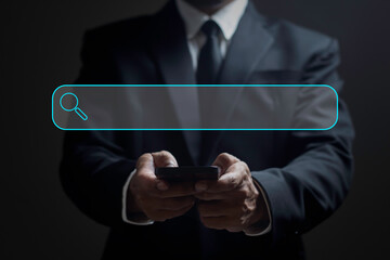 Businessman is using smartphone to Searching and Browsing Internet Data Information with blank search bar. Search Engine Optimization SEO Networking Concept.