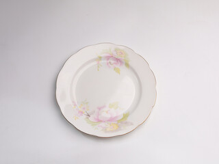 Empty plate, clear and clean, isolated on white background