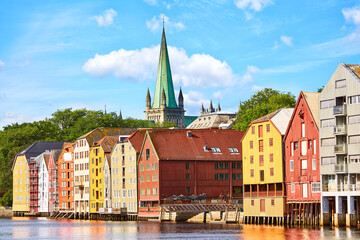 Colorful wooden houses  and Nidaros cathedral at the Nidelva river in Trondheim, Norway - 644453435