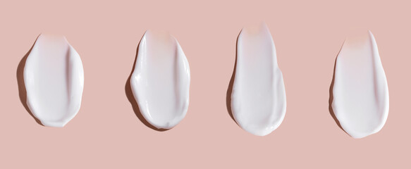Cosmetic smear of cream texture on a beige background. Skin care.