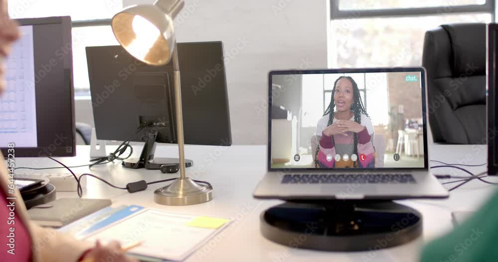 Poster Laptop with video call with african american businesswoman on screen