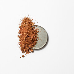 Cosmetic clay powder, crushed eyeshadow. Casual make up products. Professional makeup and fashion concept.
