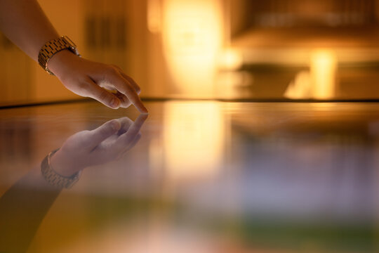 Woman using interactive touchscreen display of electronic multimedia kiosk,  Education, learning and technology concept