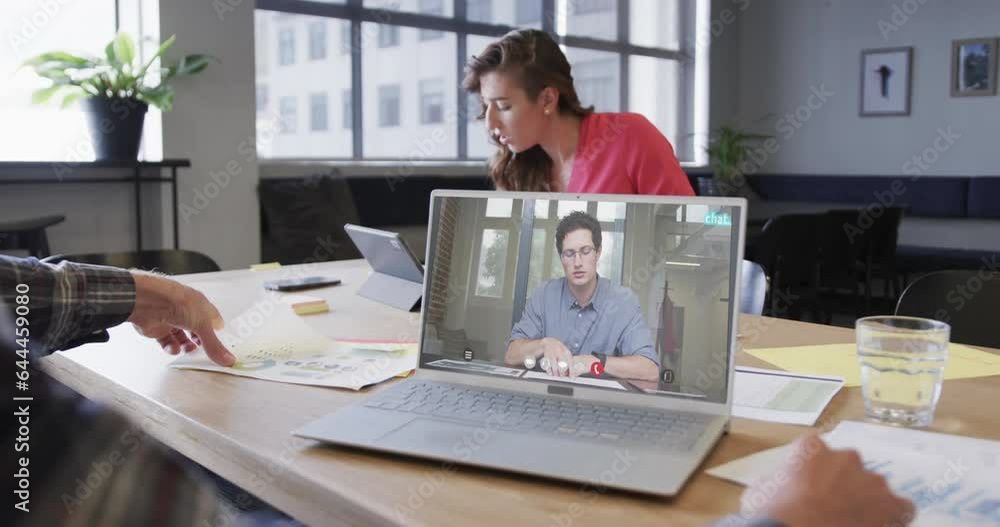 Poster Caucasian businessman on laptop video call with caucasian male colleague on screen