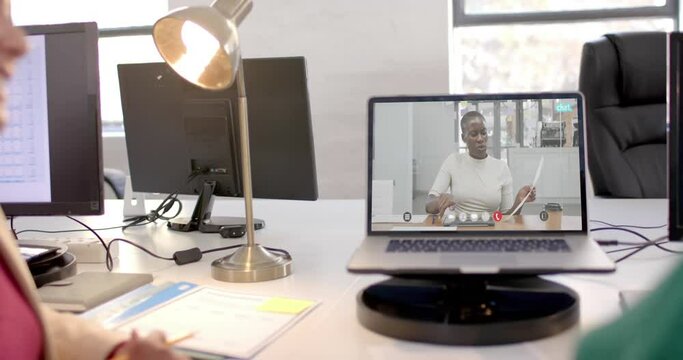 Laptop with video call with african american businesswoman on screen