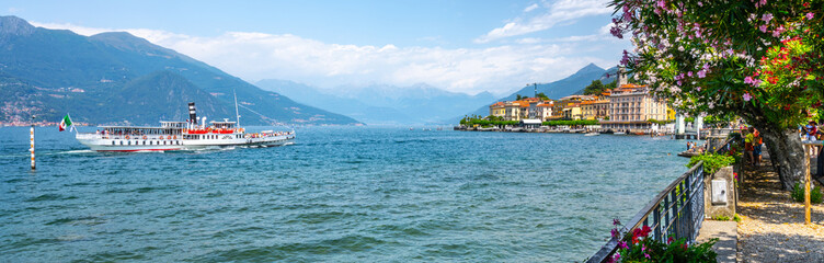 Blooming trees and flowers at Bellagio lakeshore promenade. Como Lake, Lombardy, Italy