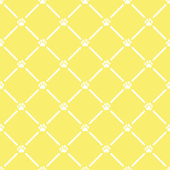 Fototapeta premium Yellow seamless pattern with little paws