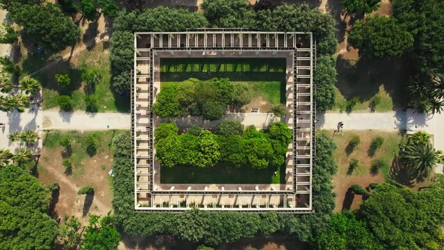 Aerial view of a square architecture in a garden with lush foliage and trees, Turia Park, Valencia, Spain