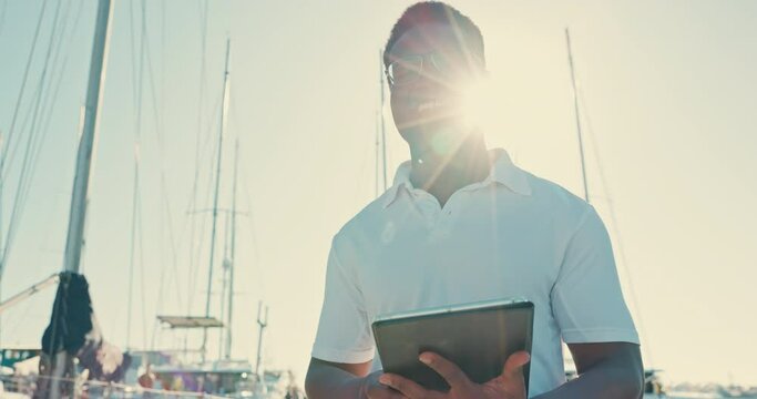 Face, tablet and black man at boat port, funny captain and laughing at sunrise in the morning. Portrait, technology and smile of sailor at ship dock in glasses to travel, holiday or vacation at ocean