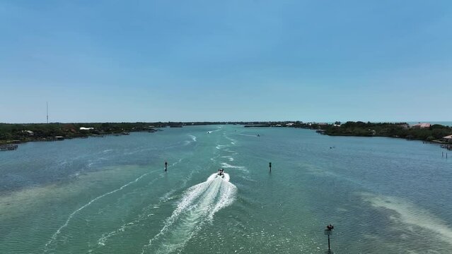 Aerial view of a motorboat sailing along Lyons Bay in Casey Key, Florida, United States.