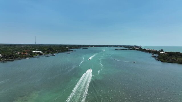 Aerial view of a motorboat sailing along Lyons Bay in Casey Key, Florida, United States.