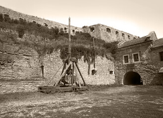 Kamyanets-Podilsky citadel tourism museum, Ukraine. 12 may 2023. Old wooden catapult in the...