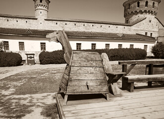 Kamyanets-Podilsky citadel tourism museum, Ukraine. 12 may 2023.  Old wooden horse for punishment in the courtyard of the castle