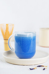 Blue matcha latte tea from clitoria flowers with coconut milk. Healthy drink, lactose, gluten and sugar free.