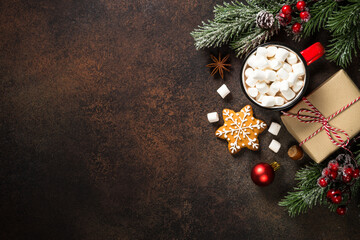 Christmas food concept. Hot chocolate, gingerbread cookies, present and holiday decorations. Top view with copy space.