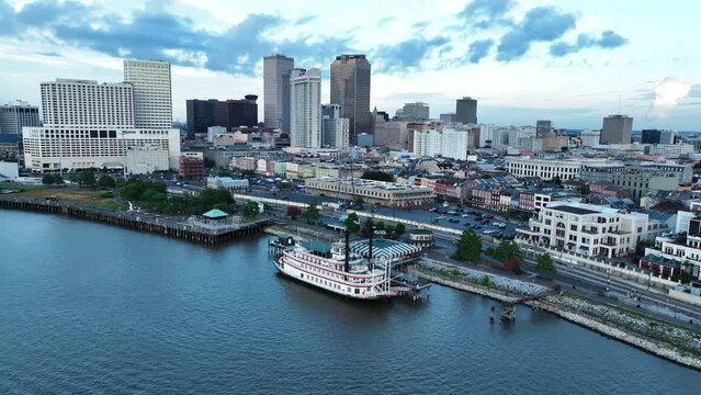 Aerial view of New Orleans skyline at twilight along the Mississippi River, Louisiana, United States.