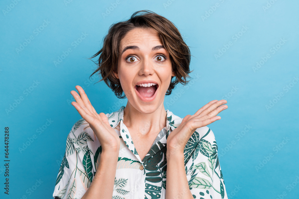 Poster photo of ecstatic pretty girl dressed colorful blouse raising palms scream yeah astonished staring i