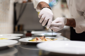 Obraz na płótnie Canvas final touch on fish carpaccio, Italian restaurant Cooking