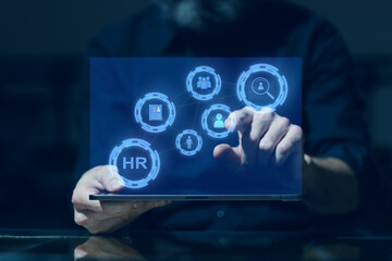 Human resources technology concept. HR manager male hands select personnel profiles for work on digital tablet