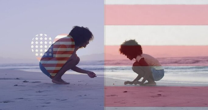 Animation of american flag and heart shape over african american mother and child playing at beach