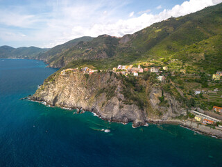 Fototapeta na wymiar small towns of Italy on the coast, sunny weather, drone photography, warm light, blue sea
