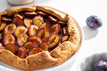 Freshly baked pie with plums. sweet galette