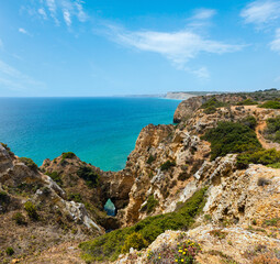 Fototapeta na wymiar Atlantic ocean summer rocky coastline view (Ponta da Piedade, Lagos, Algarve, Portugal).