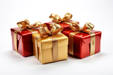 Obraz premium Red, gold gift boxes with gold ribbon on white background. New Year and Christmas design of gift boxes. Wrapping paper. Present red box, tied with gold wrapping ribbon.