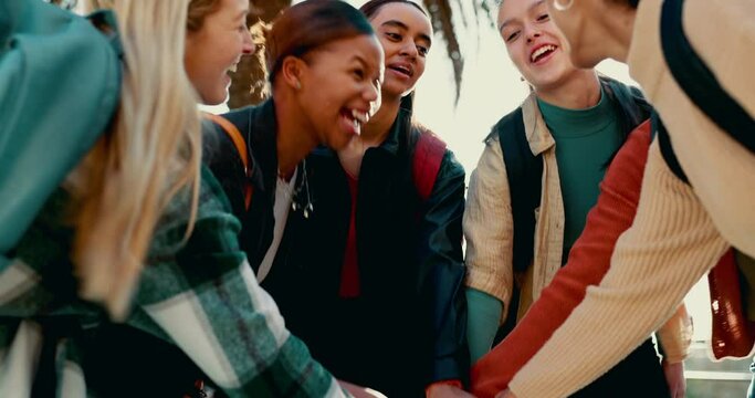 Hands stacked, happy and children at school for motivation, success and support in the morning. Smile, together and girl friends or students with a huddle for education goal, mission or excited