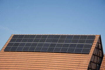 Fototapeta premium Solar modules on a large half-timbered house