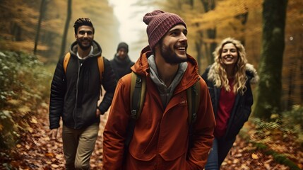 Fototapeta na wymiar Group of Friends Hiking in Scenic Autumn Forest: Embracing Adventure in Camping Attire