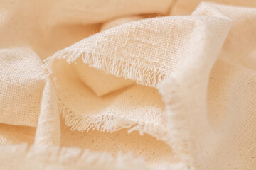 Cotton fabric closeup. Beige color.