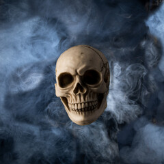 A skull surounded by smoke