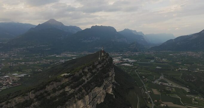 Aerial view of Torbole village among the mountains at sunset, Trentino, Italy.