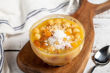 Ashura dessert on a white background. Delicious noah pudding in bowl. local name asure
