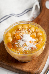 Ashura dessert on a white background. Delicious noah pudding in bowl. local name asure