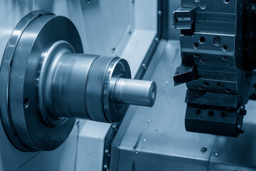 The  CNC lathe machine thread  cutting the metal shaft parts.