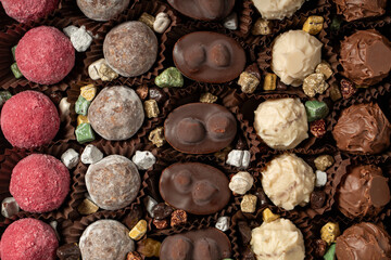 Truffle chocolate. Various chocolate pralines in bulk. Top view