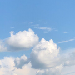 blue sky background with fluffy clouds