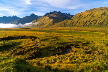 Beautiful valley with green mountains and blue sky in the early morning