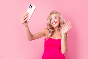 Photo of friendly cute lady wear sexy dress recording video vlog waving arm isolated pink color background