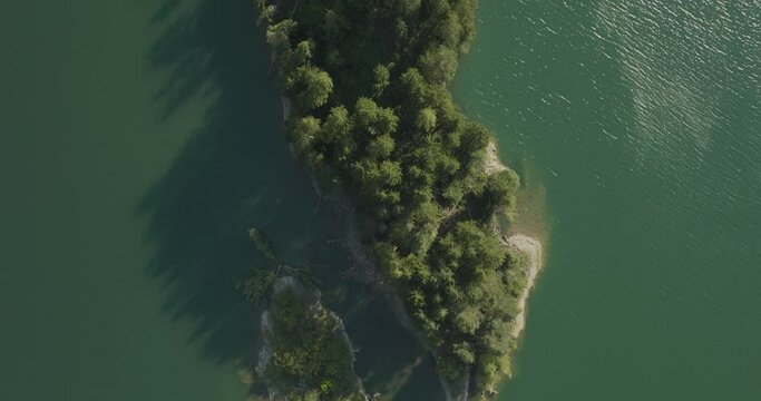 Aerial view of Caprioli Island (Isola dei Caprioli) on Cadore Lake (Lago di Cadore) on the Dolomites Mountains, Belluno, Veneto, Italy.