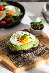 Delisious toasted bread with avocado and eggs