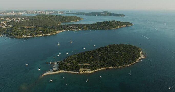 Aerial view of sailboat moored along Kotez Island at Brijuni National Park, a group of islands along the Adriatic Sea coastline near Pula, Istria, Croatia.