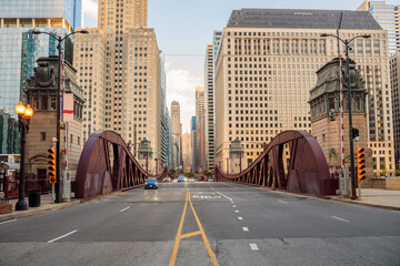 Street over a bascule bridge spanning Chicago river at sunset in spring